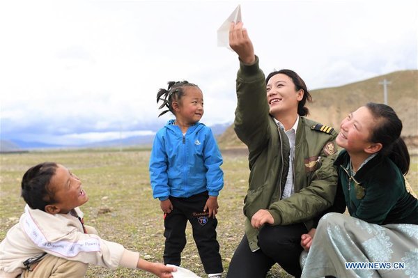 Female Pilot from Impoverished Family Flies Helicopter in China's Tibet